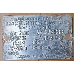 1957 Oldsmobile 98 4 dr data Trim Tag Plate Lansing Mich